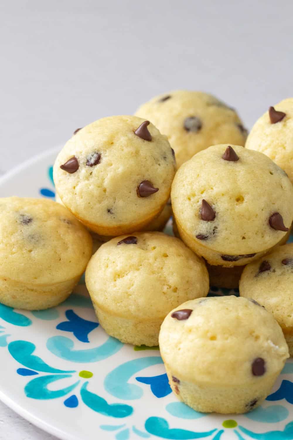 chocolate chip mini muffins on a decorative plate