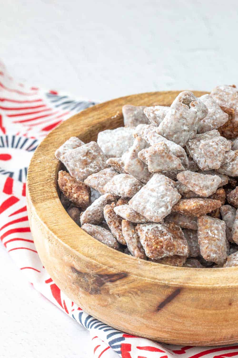 puppy chow snack mix in a brown bowl