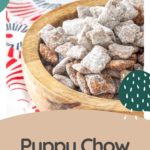 A wooden bowl brimming with powdered sugar-coated snack mix rests on a patterned fabric. The phrase "Puppy Chow" playfully adorns the scene, directing you to discover more tasty delights at HappySnackcidents.com.