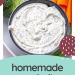 A bowl of creamy homemade ranch dip sits surrounded by crisp broccoli and carrot sticks. Text reads "delicious homemade ranch dip.