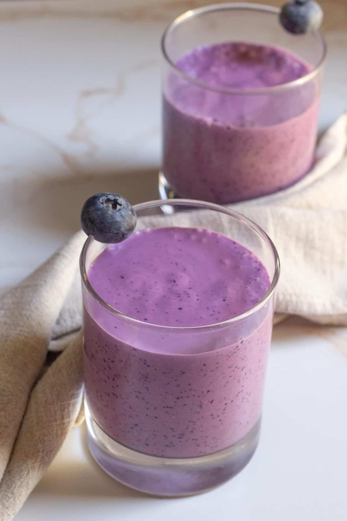 blueberry oatmeal smoothie in two glasses