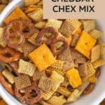 Savor a bowl of homemade Cheddar Chex Mix, perfectly paired with pretzels and cheese crackers. Elevate your snack time by dipping each bite into a rich beer cheese dip for an extra burst of flavor.