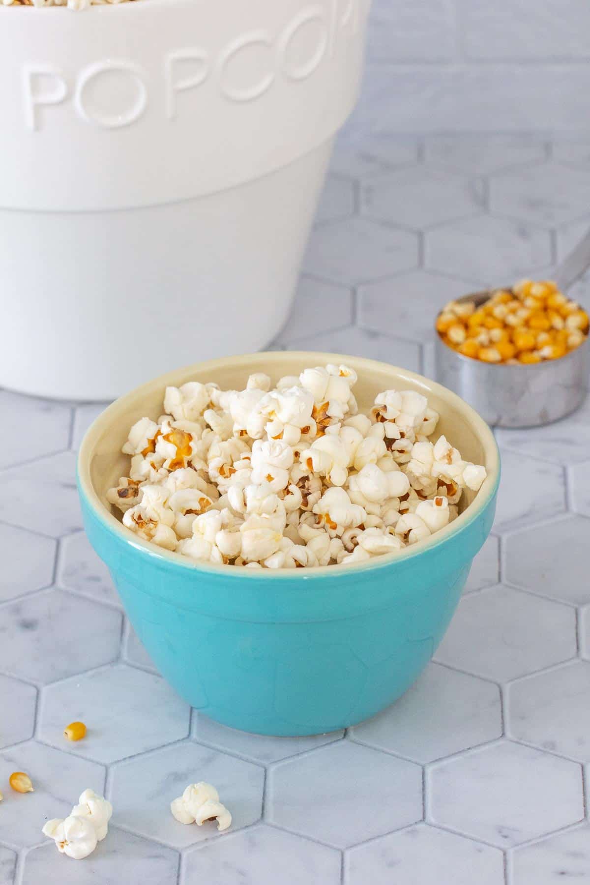 blue bowl of popped popcorn