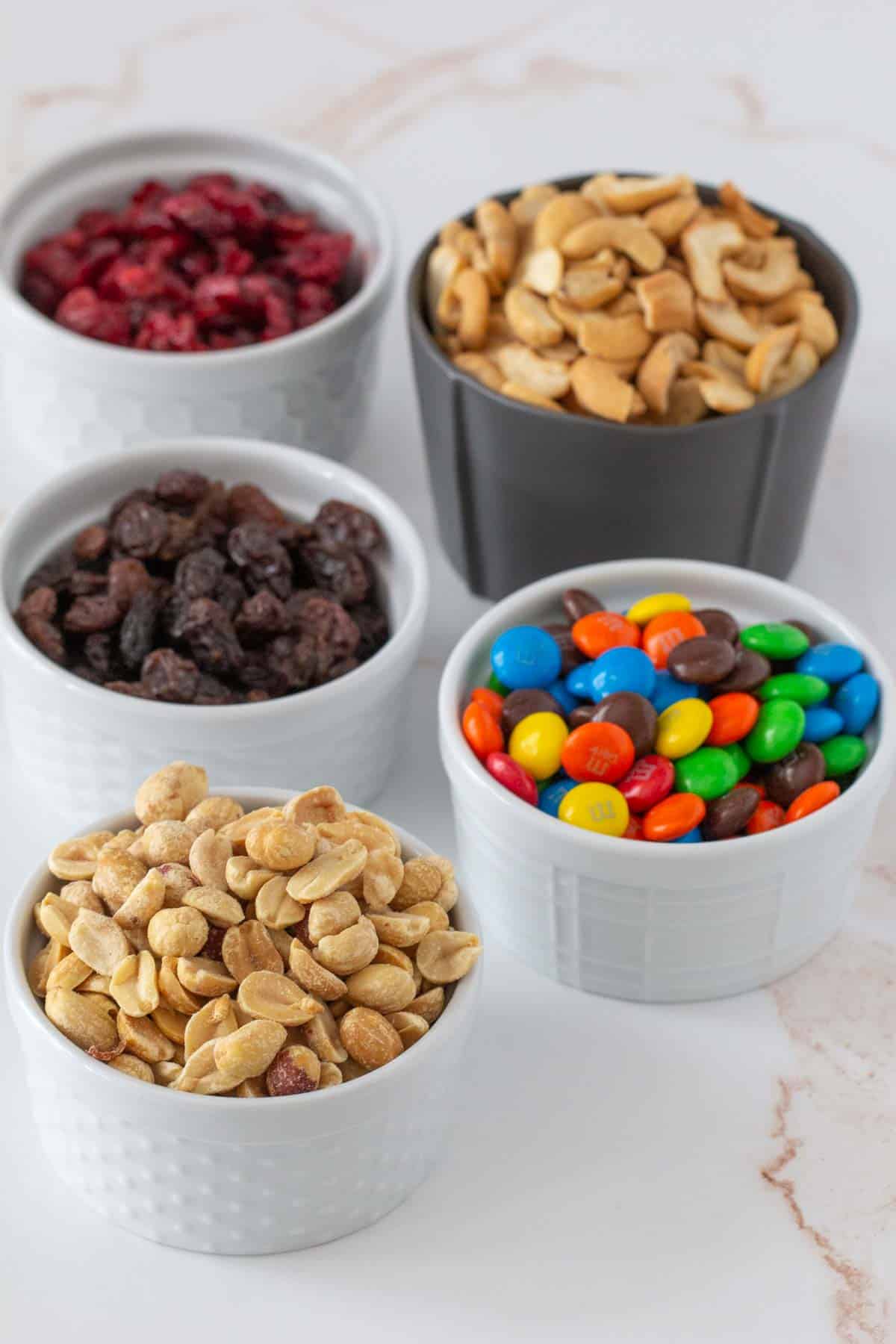 small bowls of trail mix ingredients