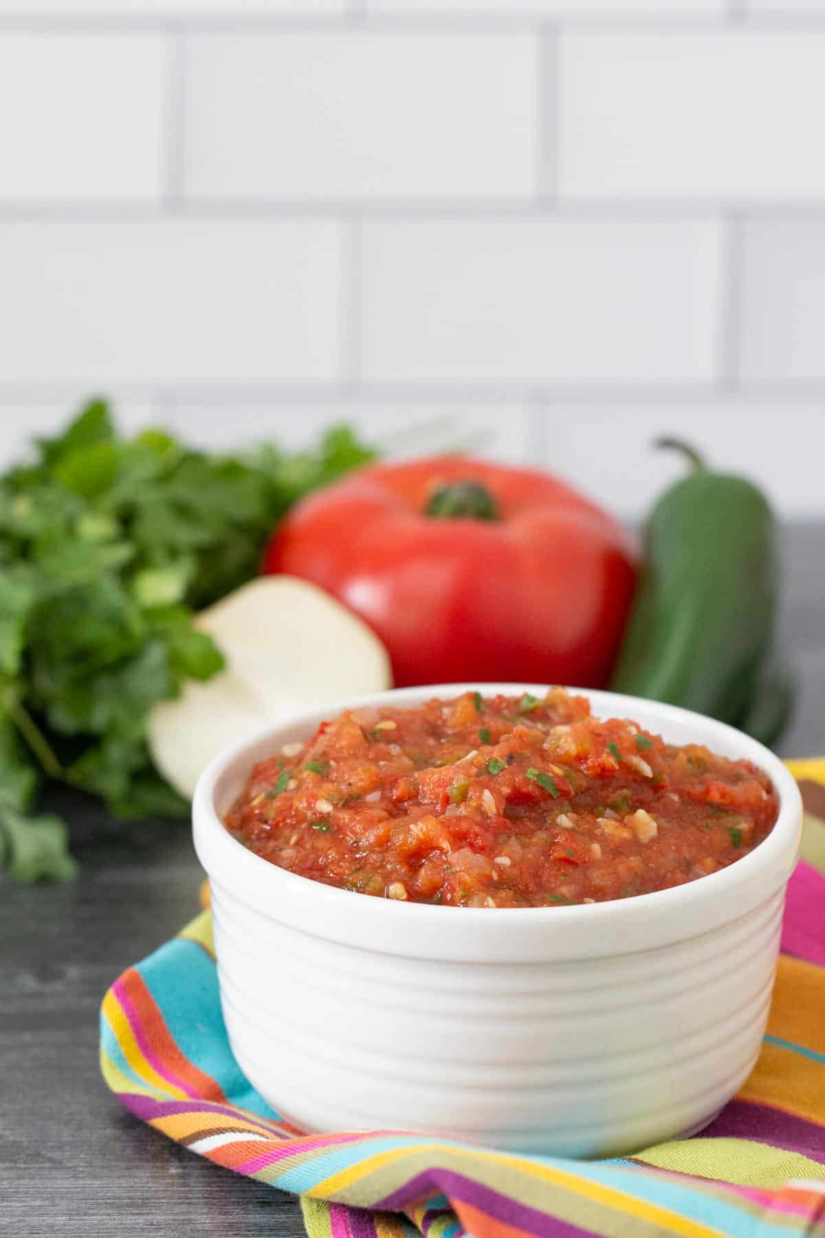 roasted tomato salsa in a bowl with a colorful napkin