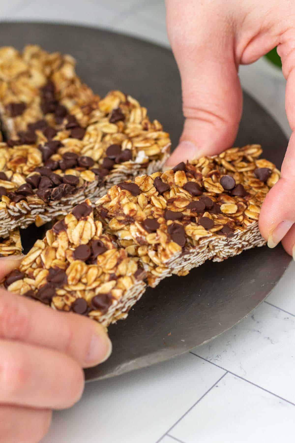 breaking apart chocolate chip granola bar