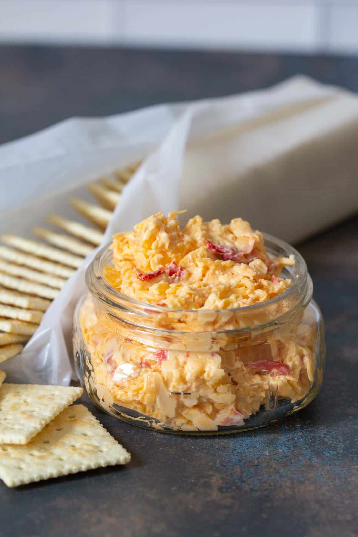 homemade pimento cheese in jar with crackers