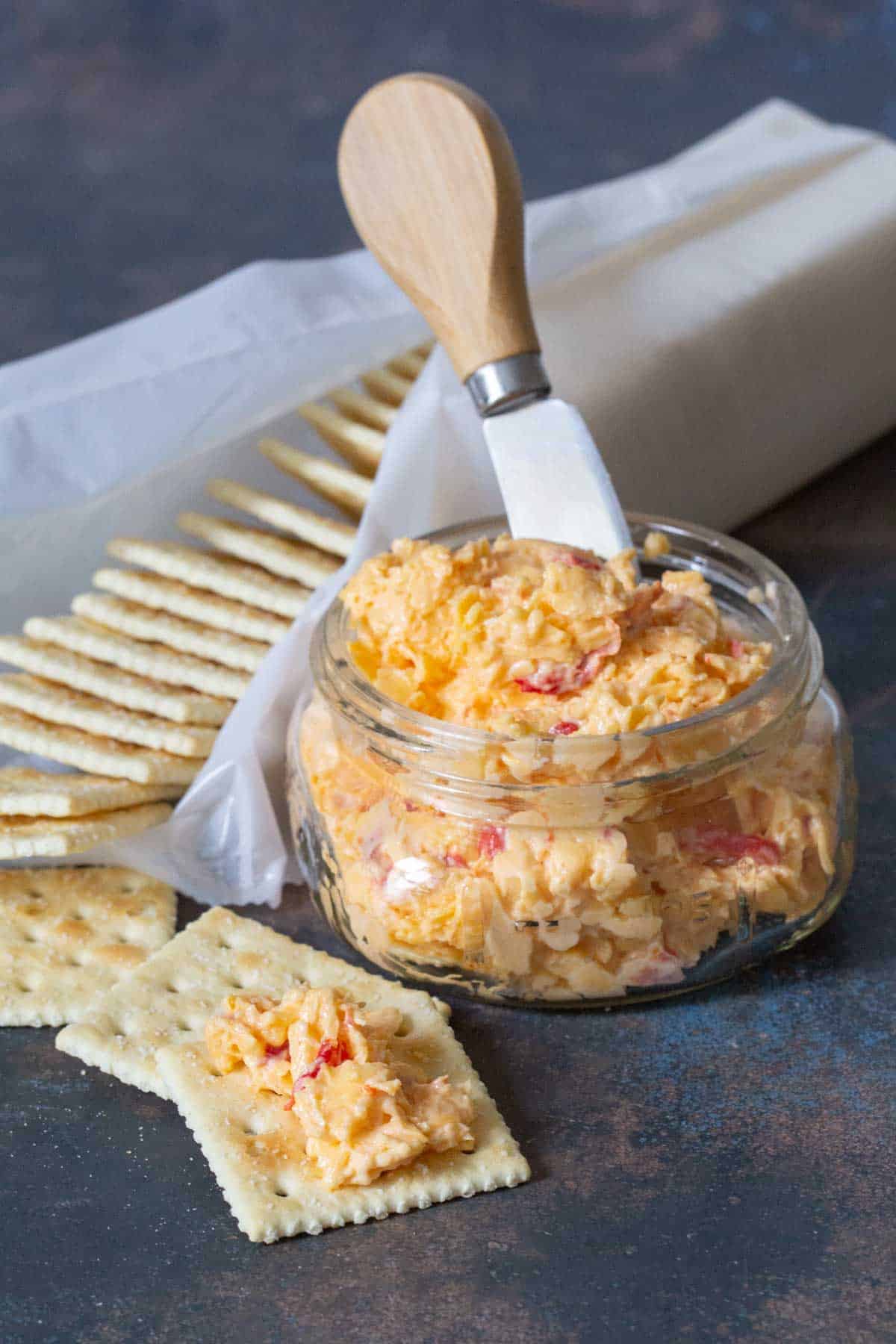 pimento cheese in glass jar with crackers