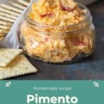 A jar of mouthwatering pimento cheese paired with crispy crackers on the side. Text reads: "Homemade recipe Pimento Cheese HappySnackcidents.com".