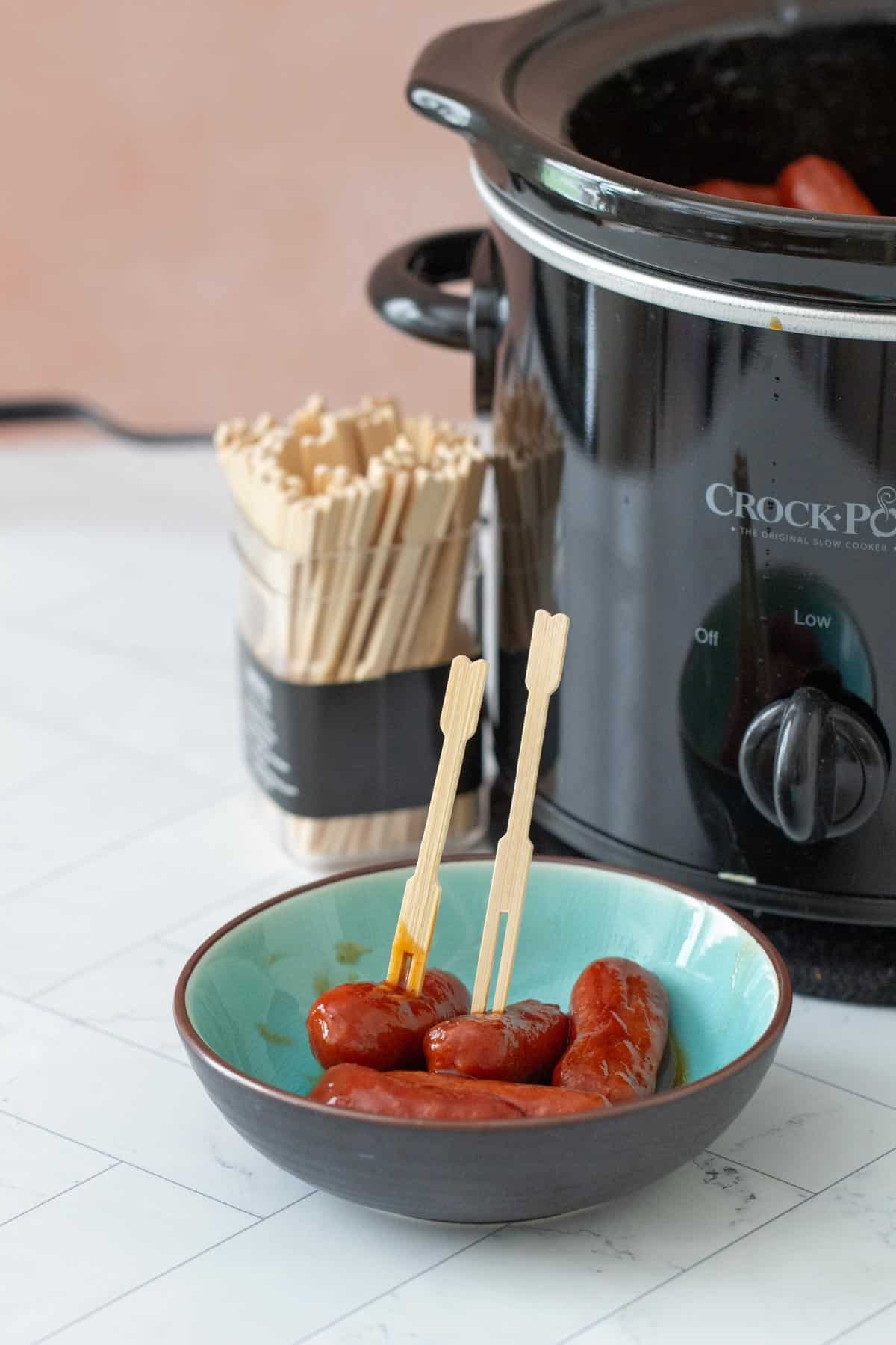 bowl of little smokies with a crockpot