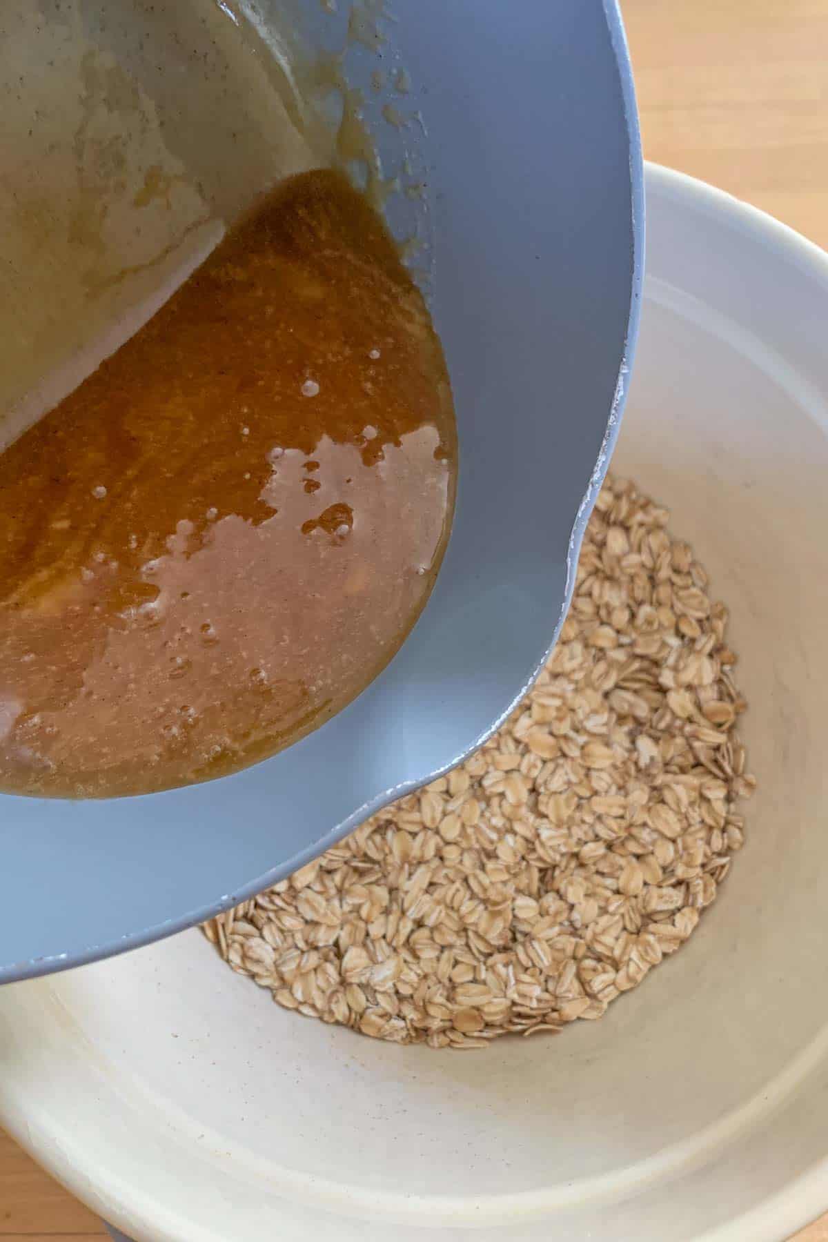 pouring melted sugar into oats