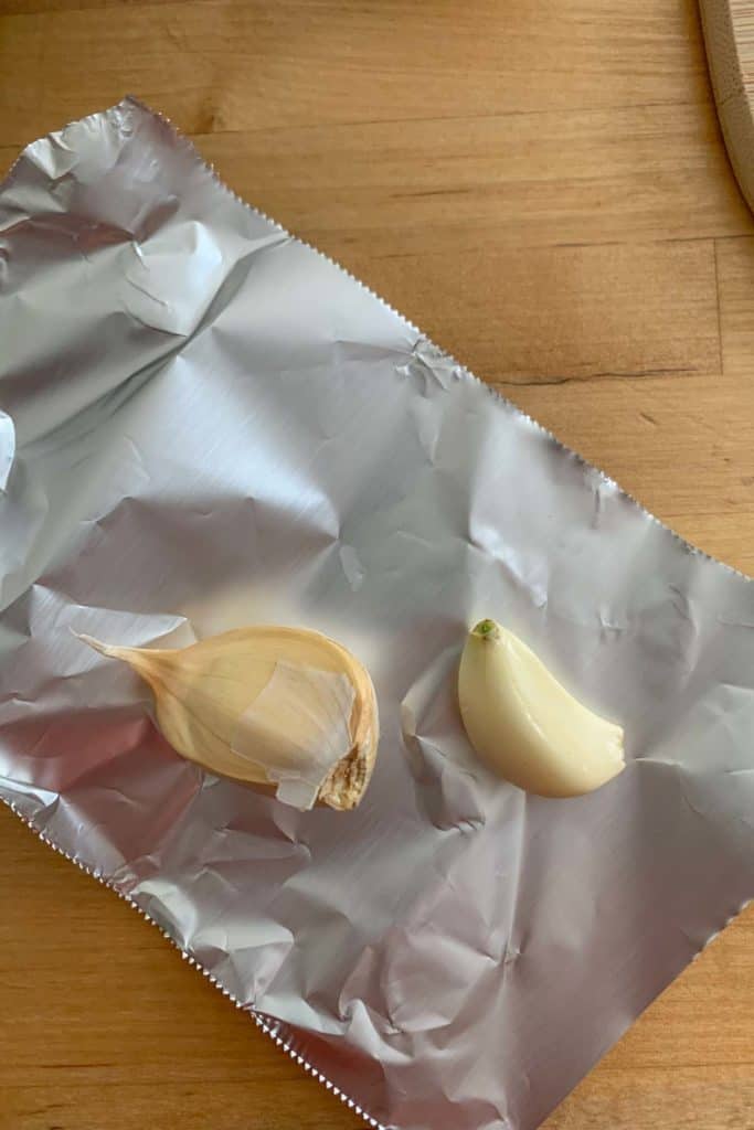 garlic cloves on foil