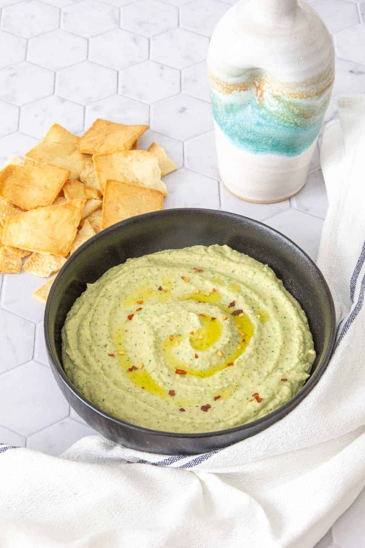 black bowl with white bean dip