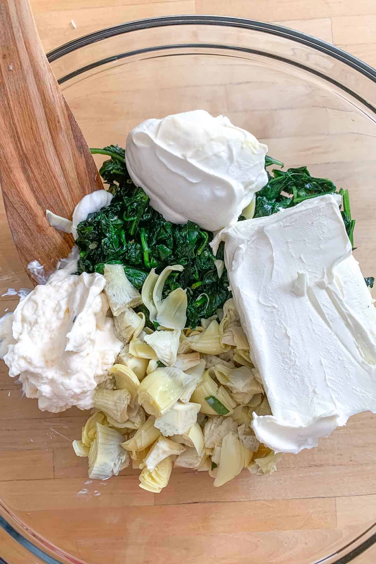 spinach artichoke ingredients in bowl