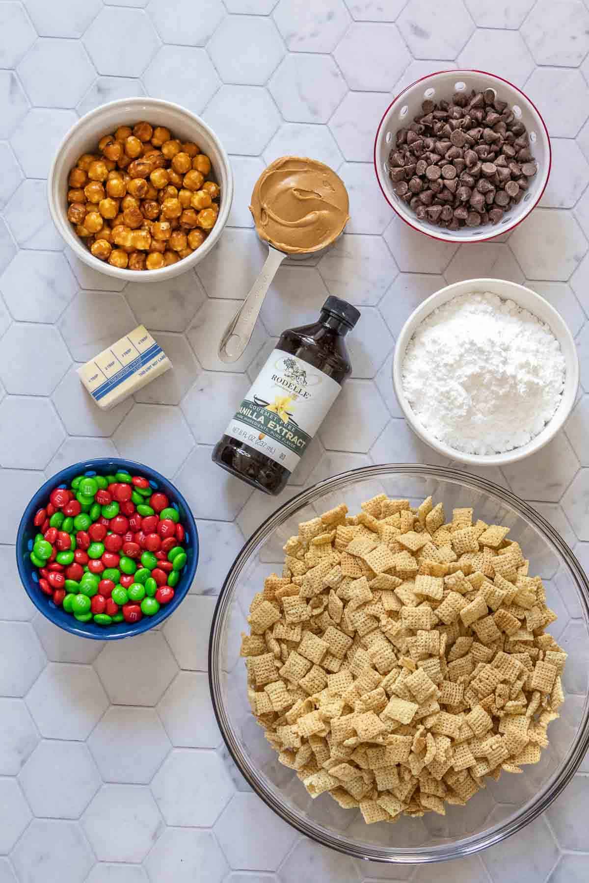 Ingredients for reindeer chow on a tile surface.