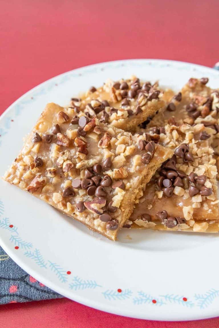Pieces of graham cracker toffee on a festive plate.