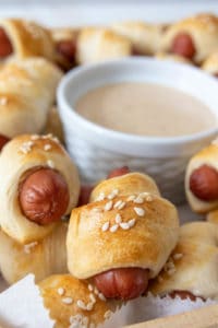 Close up of a platter of pigs in a blanket.
