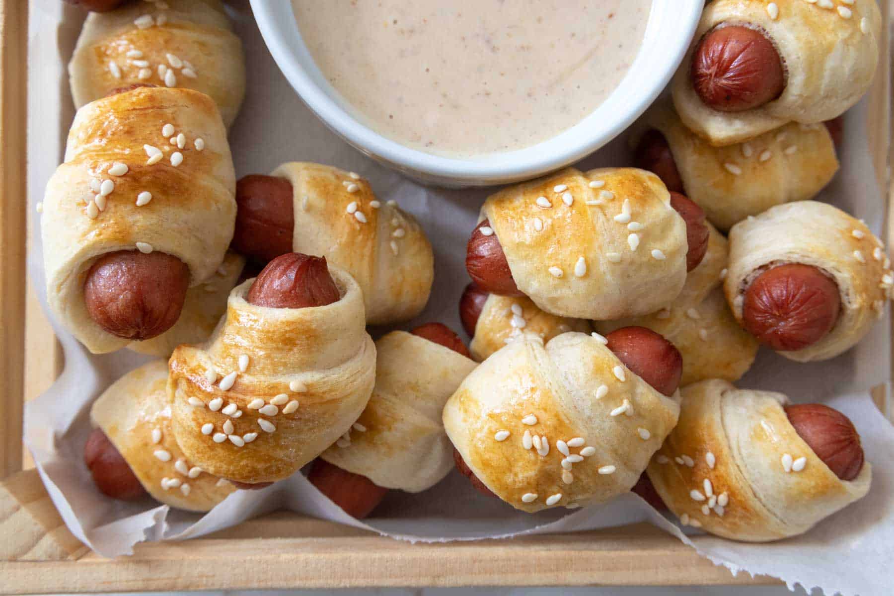 Pigs in a blanket in a serving tray.