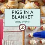 A process photo of making pigs in a blanket: dough strips being cut and wrapped around mini sausages, shown before and after baking, with a text overlay reading "Pigs in a Blanket—your next party favorite!.