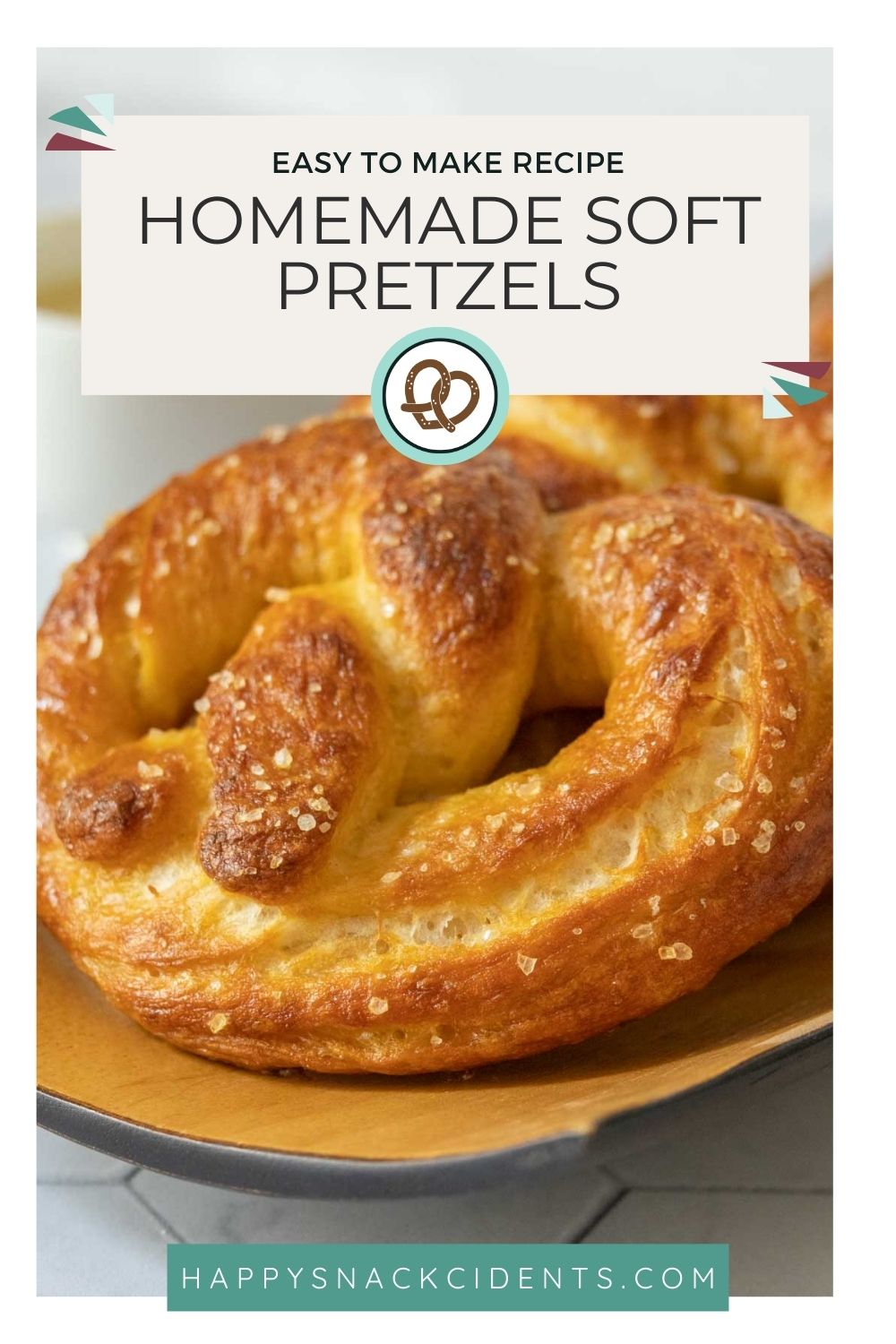 A close-up of a golden-brown homemade soft pretzel with coarse salt, accompanied by text describing it as an easy-to-make recipe.