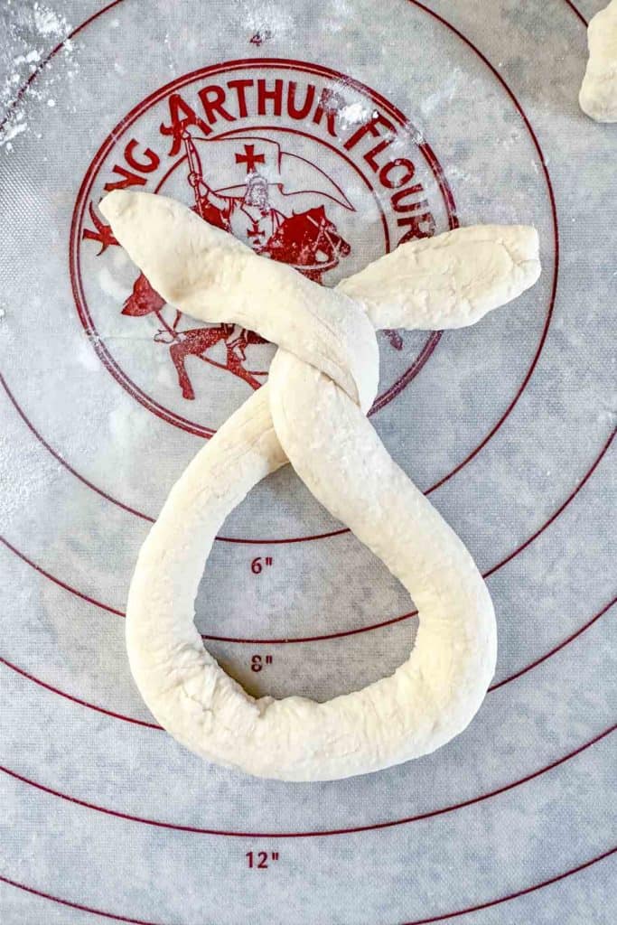 Dough twisted for making pretzel.