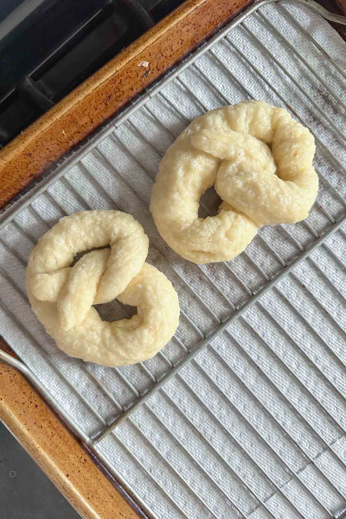 Boiled pretzels on a rack for drying.