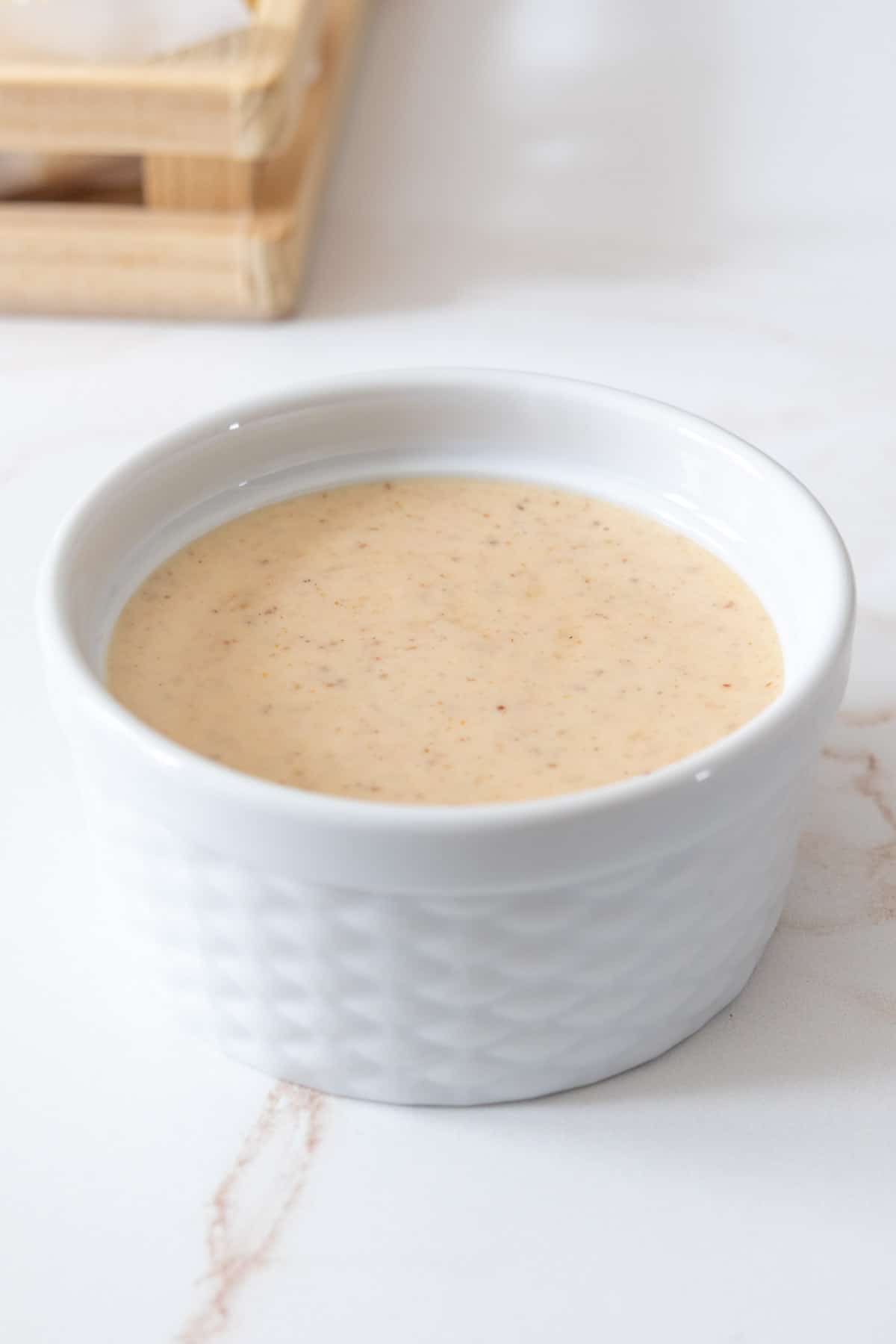 Dipping sauce in a small white serving bowl.