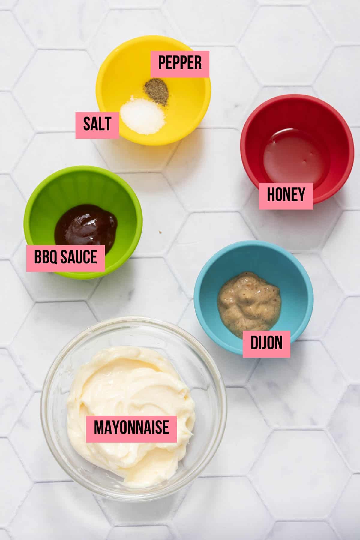 Ingredients for dipping sauce on a tile surface with labels.