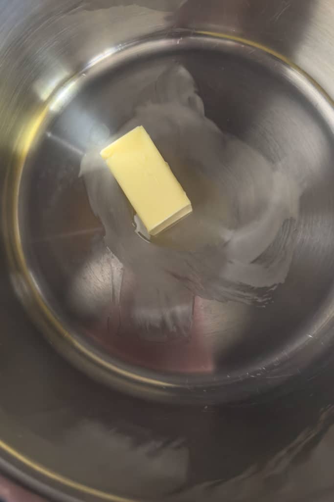 Melting butter in a pot.