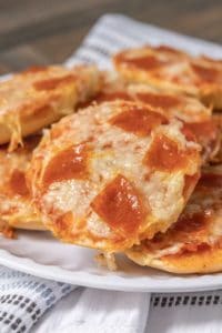 Plate of baked pepperoni pizza bagel bites.