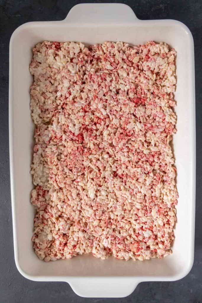 White baking pan of strawberry rice krispie treats.