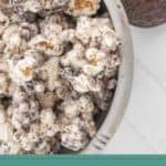 A bowl of oreo popcorn coated with crushed Oreo cookies sits beside a few whole Oreos, with the text "Oreo Popcorn" at the bottom.