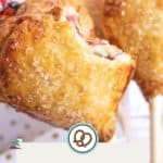 Close-up of heart-shaped pie pops with a sugary crust on sticks, displayed next to a “Pie Pops” label and a website URL at the bottom.