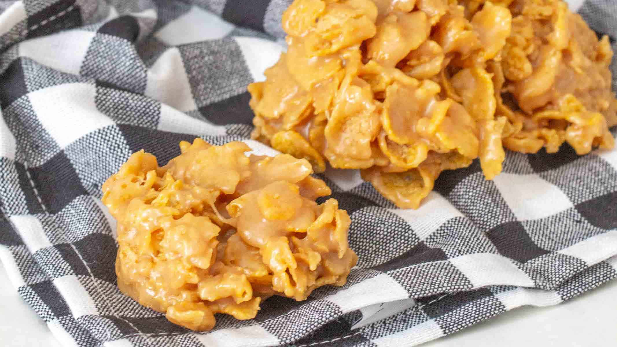 Crunchy cornflake cookies on a blanket.