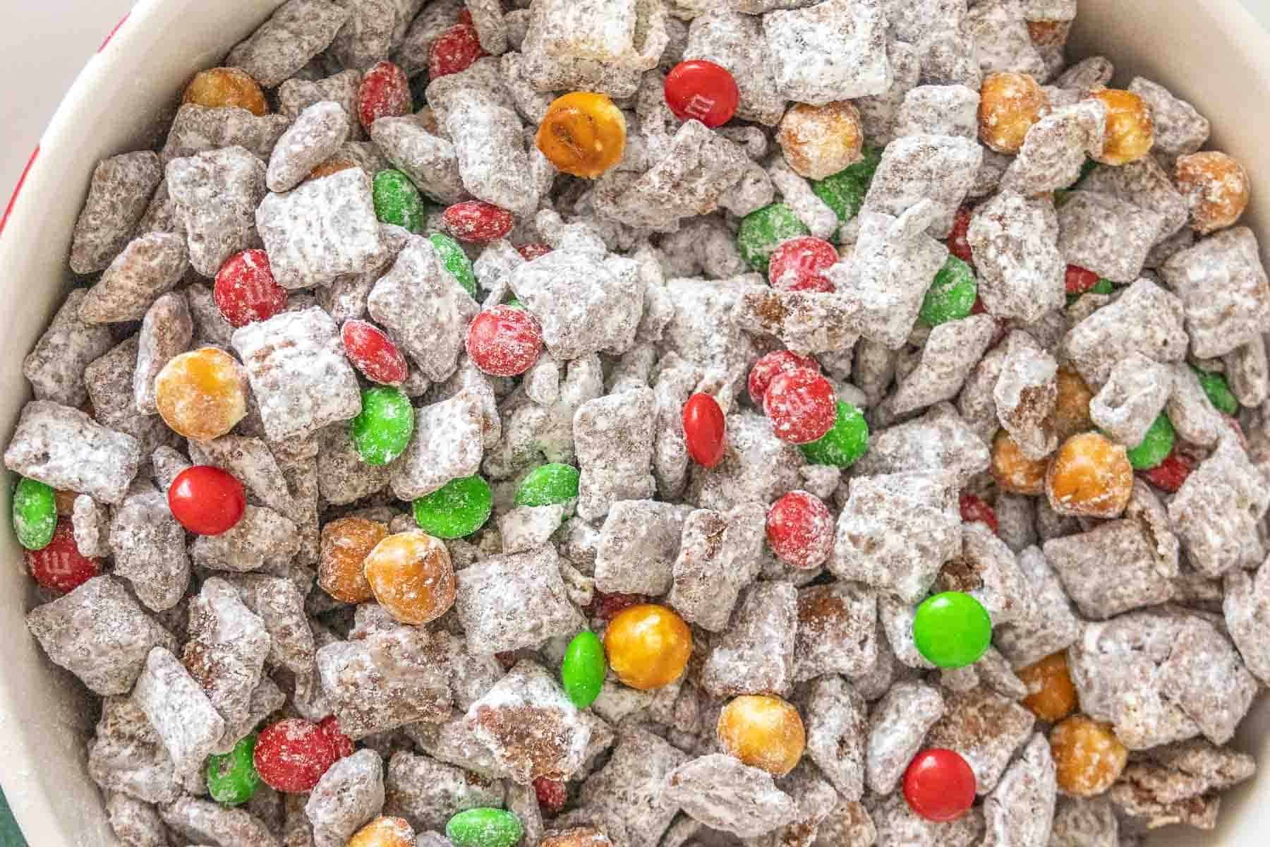 Overhead photo of reindeer chow consisting of muddy buddies, pretzels and m&Ms.