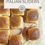 Nine Italian sliders with seasoned buns and melted cheese are arranged on parchment paper, some pulled apart to show cheese stretch. Text reads “Italian Sliders” and “happysnackcidents.com.”.