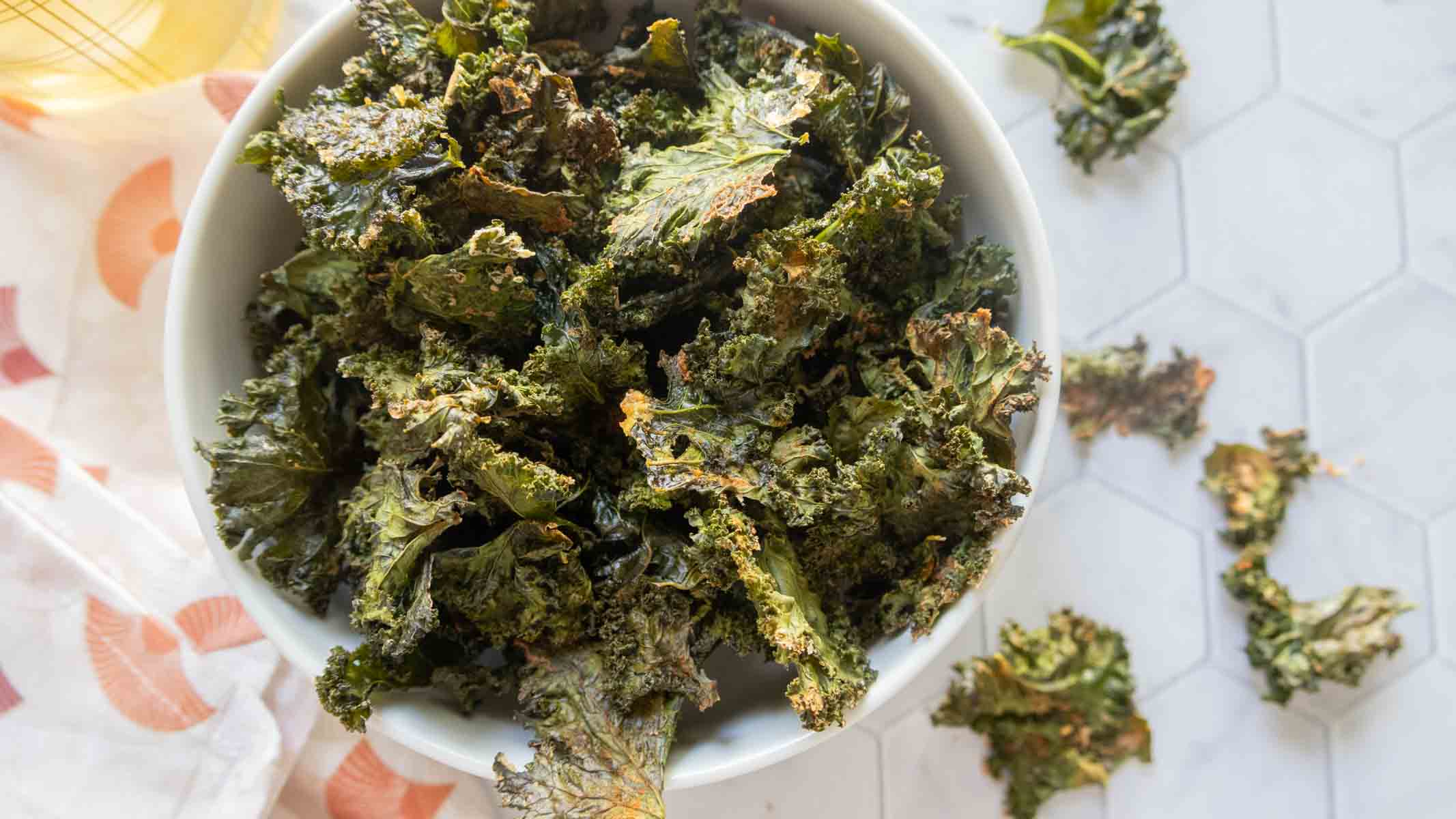 Crispy baked kale chips seasoned with salt and olive oil.