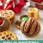 A close-up of pretzel bites topped with Rolos, pecans, and candy-coated chocolates, with a festive ribbon, popcorn tin, and Rolos in the background. Text reads "ROLO PRETZEL BITES.